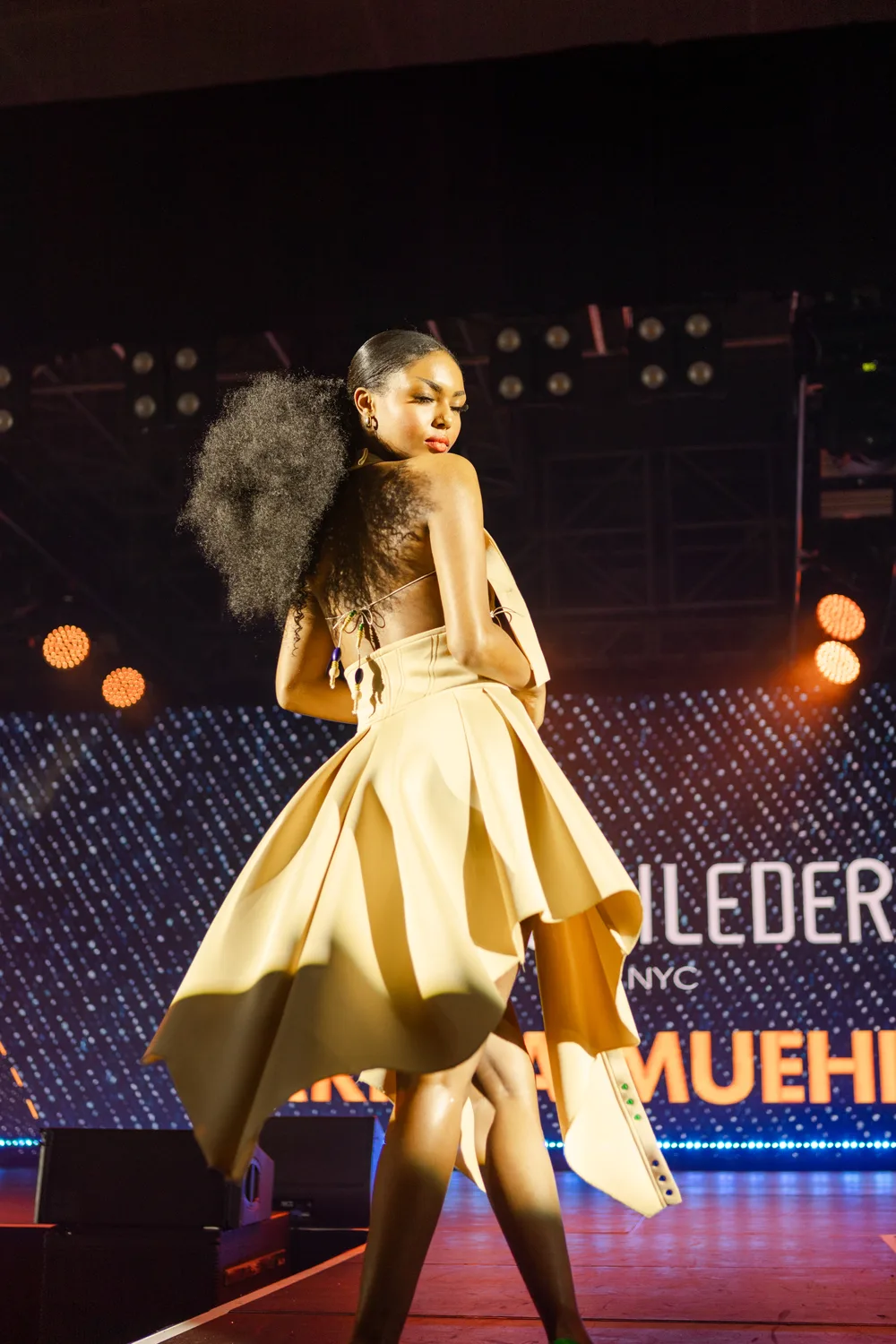 A model on the runway in a Muehleder look